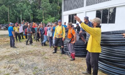 HEINEKEN Cares_Villagers grouping up to begin work to install a new gravity water system